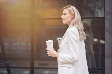 Portrait of a businesswoman standing and relaxing during a break.