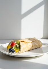 Fresh Fruit Wrap with Yogurt and Berries on White Plate