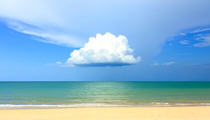 A serene beach scene with a single large cloud