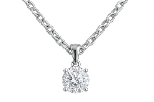 Studio shot of a silver chain holding a solitaire diamond pendant, isolated on a transparent background
