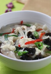 A filling Korean sujebi made with chewy dough and enoki, shiitake, and wood ear mushrooms. A dish by Master Chef Hanshunseop. Photographed in Korea.