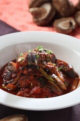 Traditional Korean braised mackerel dish with pine mushrooms and bold chili sauce. Deep flavor and spice. A dish by Master Chef Hanshunseop. Photographed in Korea.