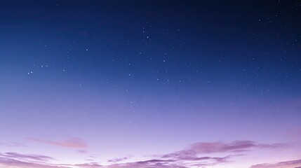 Fototapeta premium Beautiful cloudless night sky with stars and soft blue-purple gradient, captured in panorama with wide angle and long exposure at sunset, boasting high resolution and a peaceful atmosphere.