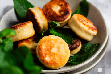 sirniki. Homemade cottage cheese pancakes with sour cream