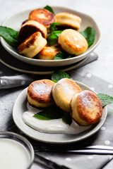 sirniki. Homemade cottage cheese pancakes with sour cream