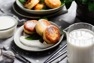 sirniki. Homemade cottage cheese pancakes with sour cream