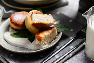 sirniki. Homemade cottage cheese pancakes with sour cream