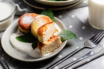 sirniki. Homemade cottage cheese pancakes with sour cream