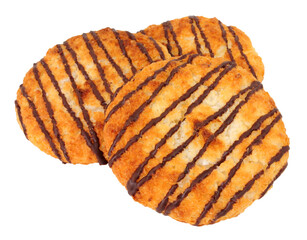 Coconut macaroons with shredded coconut and drizzled with chocolate flavoured topping isolated on a white background
