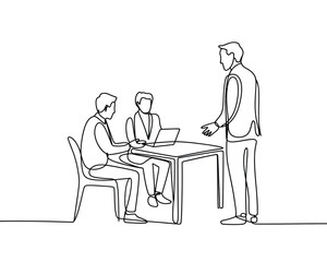 Business meeting with three people and a laptop