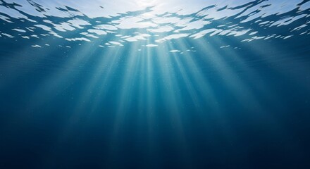 Obraz premium Sunlight beams piercing tranquil ocean depths creating a serene, underwater ambiance