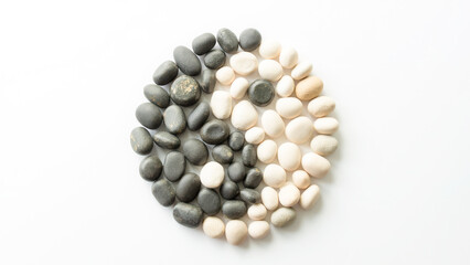 Round Arrangement of Black and White Stones on a Clean Background for Peaceful Decor