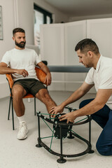 Fototapeta premium Podiatrist placing patient's foot on medical device for examination
