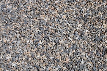 Texture de galets naturels concassés, gravier, multicolores pour bordure, décoration de jardin, cours, allée