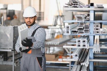 PVC industry worker or operator making frames for windows and doors