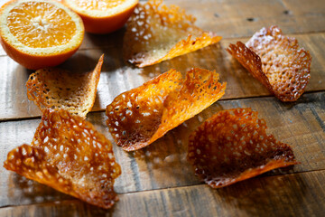 French tuile cookies. Classic butter and orange oval-shaped tuile cookies, a French recipe.