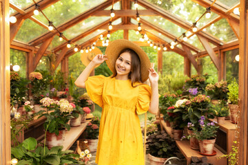Closeup Portrait of happy teen girl with long hair and straw hat. Beautiful smiling child girl...