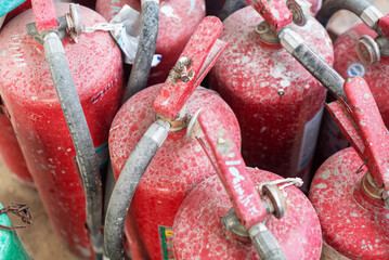 Red Fire Extinguishers with Dusty Surface