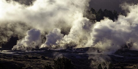 Fototapeta premium a geothermal energy plant, with steam rising from the ground, symbolizing natural energy harnessed from the earth.