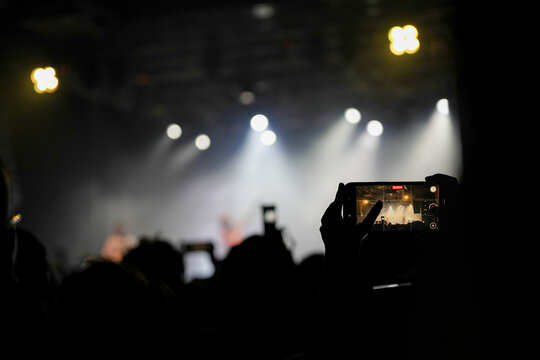 crowd at concert live house, phone taking photo
