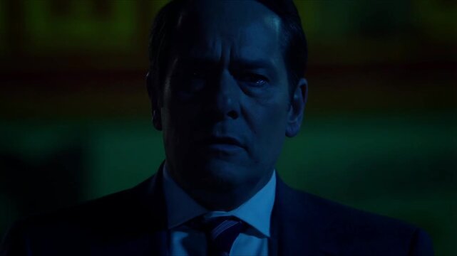A bold poster of a confident strong man tears apart, revealing the same man behind it in close-up with eyes full of exhaustion and pain, captured in dramatic cinematic detail