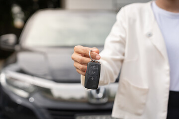 lease, rental car, sell, buy. Dealership manager send car keys to the new owner.  Sales, loan credit financial, rent vehicle, insurance,  renting, Seller, dealer, installment, car care business