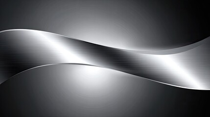 Abstract metallic wave design.  Dark gray background with a flowing, reflective silver metallic wave