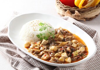 Oyster mushroom and tofu rice bowl, a savory Korean dish prepared with rich sauce by master chef...