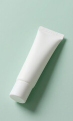 A simple, clean mockup of a white, unbranded cosmetic tube for cream or lotion on a soft mint green background, representing skincare and wellness.