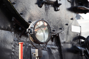 headlights on an old train, close-up, historical