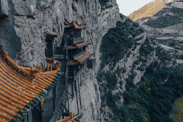 The Hanging Temple built on a cliffside surrounded by mountains in Shanxi, China