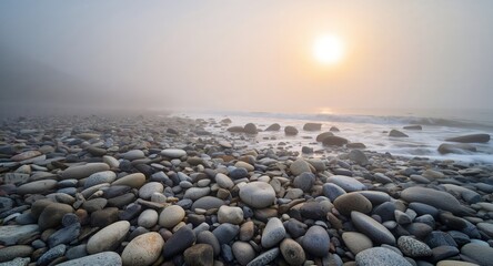Misty Morning at the Pebble Beach. Sunrise Waves and Smooth Rocks by the Sea