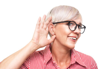 Close up woman holding palm near his ear trying to listen something interesting, isolated on white...