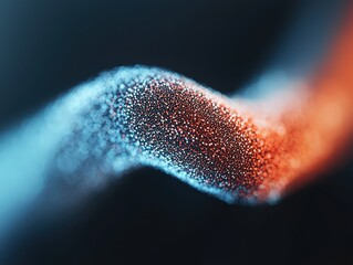 Abstract close-up of swirling microscopic particles forming a glowing blue and orange ribbon-like structure against a dark background.
