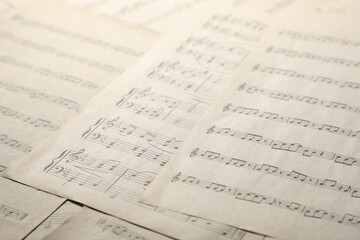Sheets with musical notes as background, closeup
