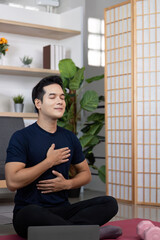 Mindfulness and Wellness. Man practicing deep breathing during meditation.