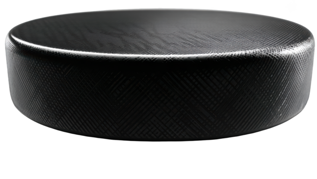 Close-up of a hockey puck on a black background, with intricate textured surface