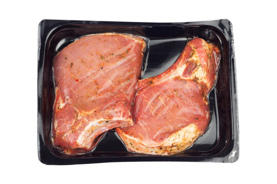 marinated steak in vacuum packaging, isolated from the background