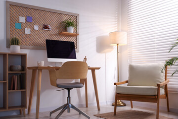 Stylish workplace with wooden desk and computer at home office. Interior design