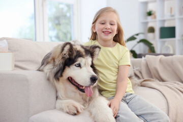 Girl suffering from allergy with her dog at home