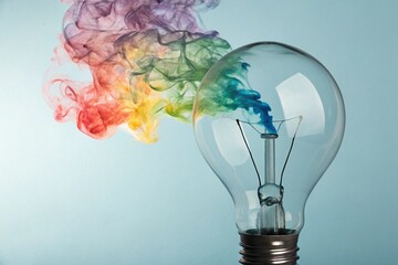 Light bulb with colorful smoke symbolizing creativity and ideas