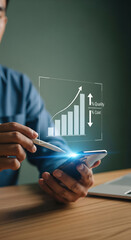 Businessman analyzing digital bar graph with stylus and smartphone, showing increasing quality and decreasing cost, modern technology, financial growth, and innovation concept