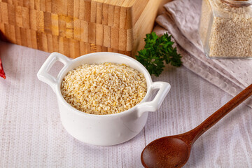 Raw dry sesame seeds heap