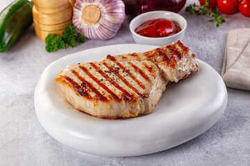 Tasty hot grilled bone steak served sauce