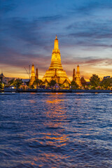 Twilight view of Wat Arun Ratchawararam Ratchawaramahawihan at sunset in bangkok Thailand. Landmark of Along the Chao Phraya River Thailand