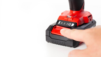 Replacing the battery in a new drill screwdriver on a white background, battery charge and...