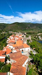 Obraz premium High-angle view of a quaint European town nestled in a valley
