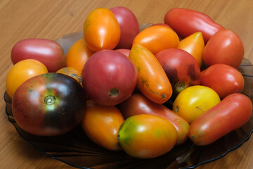 Vibrant assortment of heirloom tomatoes on a wooden table