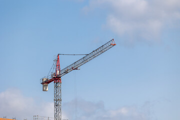 Construction crane dominating skyline during building process