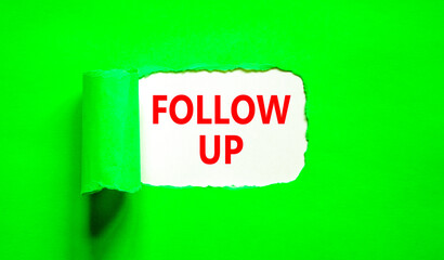 Follow up symbol. Concept word Follow up on beautiful white paper. Beautiful green paper...